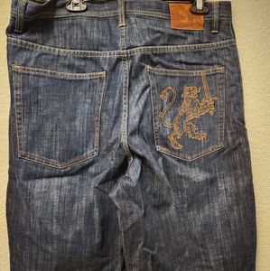 Sean John Size 34 denim shorts with lion embroidered on the back pocket